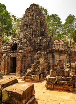 Low relief carving decorative sanctuary sculpted elements Ancient bas-relief decorated temple old ruin stone wall of Angkor wat complex Siem Reap UNESCO World Heritage Site Cambodia.