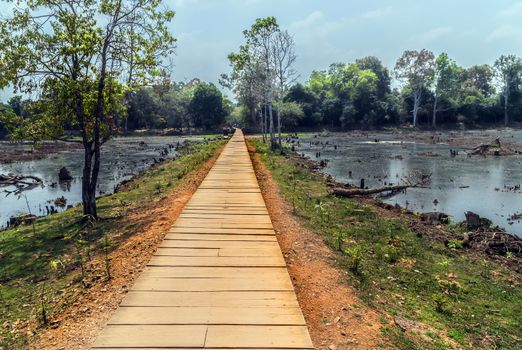 Jayatataka Baray pond Neak Pean artificial island to the Angkor temple complex Lost ancient Khmer Empire city in the jungle in Siem Reap Cambodia.
