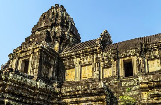 Ancient temple old ruin stone wall of Angkor wat Lost Khmer city in the jungle Siem Reap UNESCO World Heritage Site Cambodia.