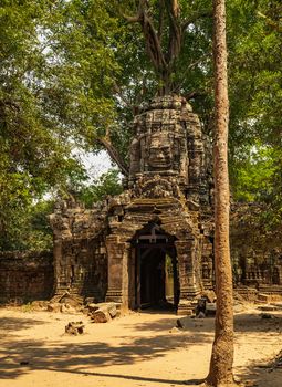 Eastern Gate entrance ways gopuram in Ta Som small temple at Angkor Khmer architecture. Angkor wat Lost ancient Khmer Empire city in the jungle in Siem Reap Cambodia.