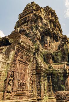 Low relief carving decorative sanctuary sculpted elements Ancient bas-relief decorated temple old ruin stone wall of Angkor wat complex Siem Reap UNESCO World Heritage Site Cambodia.