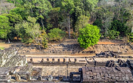Ancient temple old ruin stone wall of Angkor wat Lost Khmer city in the jungle Siem Reap UNESCO World Heritage Site Cambodia.