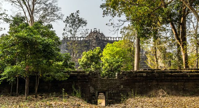 Ancient temple old ruin stone wall of Angkor wat Lost Khmer city in the jungle Siem Reap UNESCO World Heritage Site Cambodia.