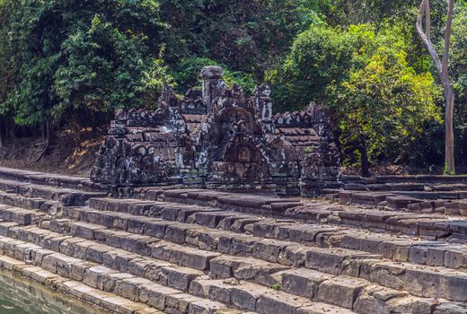 Jayatataka Baray pond Neak Pean artificial island to the Angkor temple complex Lost ancient Khmer Empire city in the jungle in Siem Reap Cambodia.