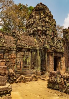 Low relief carving decorative sanctuary sculpted elements Ancient bas-relief decorated temple old ruin stone wall of Angkor wat complex Siem Reap UNESCO World Heritage Site Cambodia.