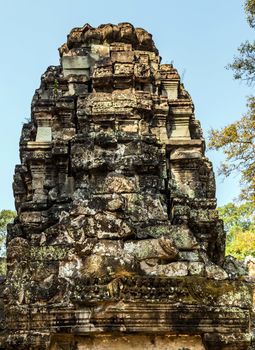 Low relief carving decorative sanctuary sculpted elements Ancient bas-relief decorated temple old ruin stone wall of Angkor wat complex Siem Reap UNESCO World Heritage Site Cambodia.