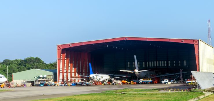 mechanic service maintenance repair passenger aircraft in a hangar