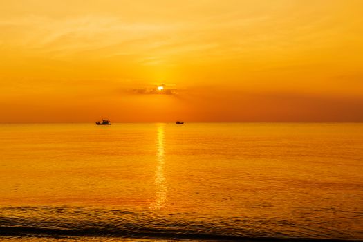 panoramic view of tropical surfers at sunset morning sky