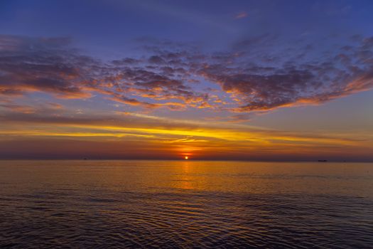 Sunset Gold sea background morning sky. Sunset sea waves. Summer sunset.