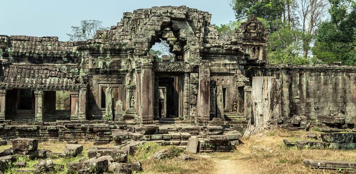 Ancient temple old ruin stone wall of Angkor wat Lost Khmer city in the jungle Siem Reap UNESCO World Heritage Site Cambodia.