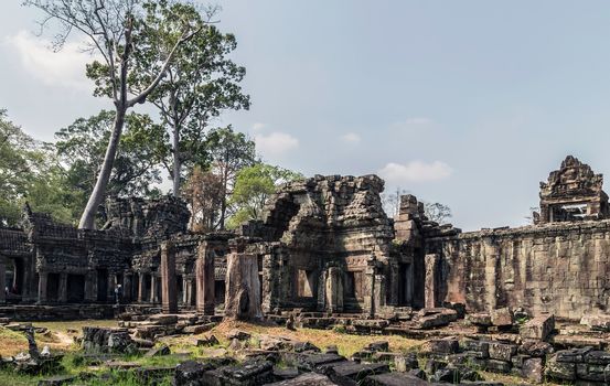 Ancient temple old ruin stone wall of Angkor wat Lost Khmer city in the jungle Siem Reap UNESCO World Heritage Site Cambodia.