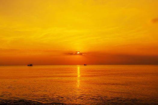 panoramic view of tropical surfers at sunset morning sky
