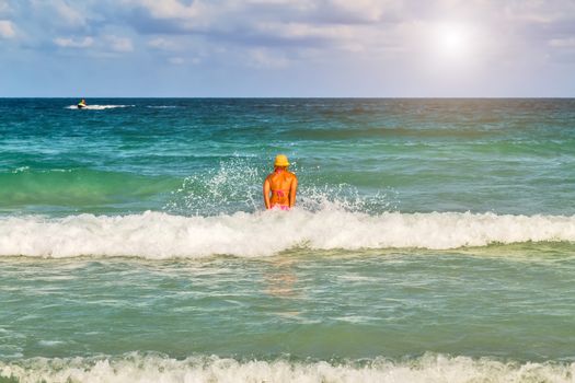 Sexy woman in bikini. Summer time in beach landscape tropical vacation.