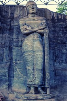 statue standing image mudra Buddha in rock Gal Vihara, Polonnaruwa, Sri Lanka