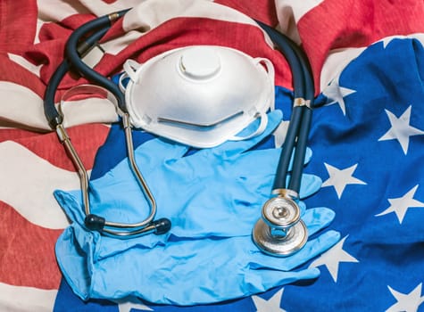 Quarantine COVID-19 american national flag background. Sprague Rappaport Stethoscope Particulate Respirator Surgical Mask gloves hygienic health protection concept Coronavirus