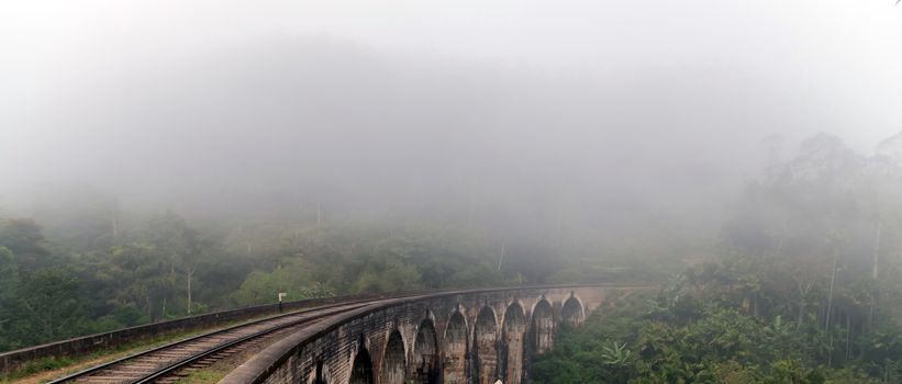 Nine Arch Bridge in Demodara Railroad Tracks in the Fog Sri Lanka is a famous landmark