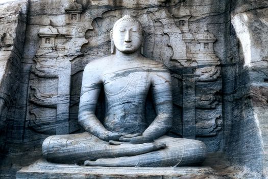 Buddha statue Close-up Sitting of the granite rock carving and sculpting arts of the ancient Gal Vihara Polonnaruwa - Sri Lanka