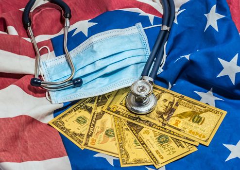 Finance business concept quarantine american flag background. Stethoscope Particulate Respirator Surgical Mask US currency cash bill design american dollars banknotes money gold fake