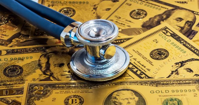 Stethoscope US currency cash note bill design american dollars banknotes money gold fake background Finance business concept
