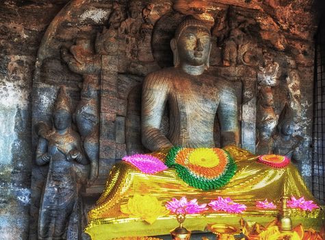Buddha statue Sitting of the rock carving sculpting arts of the ancient Gal Vihara Polonnaruwa Sri Lanka Archaeological