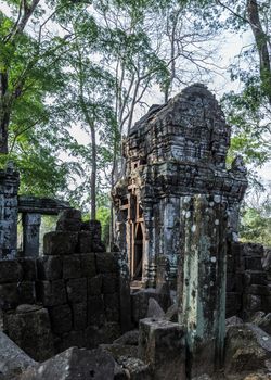 Prasat Krahom red bricks Hindu Temple in Koh Ker. Moss on the stone brick sandstone laterite blocks archaeological Landscape of Koh Ker, Northwest Cambodia