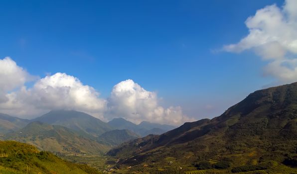 Mountains, mountain peak hill top nature landscape. Camping landscape and hiking travel adventure tourism. Amazing Sunrise over the mountain range.