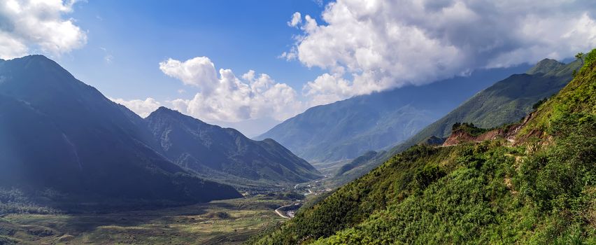 Alps mountain sunny afternoon. Green Wonderful springtime landscape in mountains. Grassy mountain ridge and rolling hills.