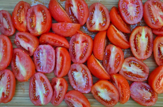 Freshly sliced roma tomatoes ready for cooking