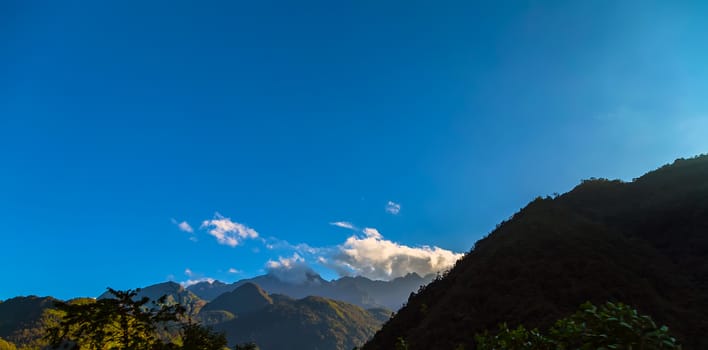 Mountain range sunset view clouds panoramic landscape sky panorama.