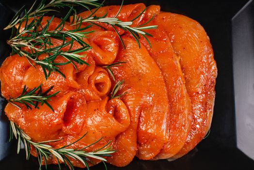 Raw chicken thinly sliced slices in a marinade with spices, satilisimo. Satilisimo in a marinade. Dietary meat. Cooking.Marinated raw meat.