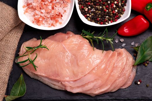 Raw sliced chicken meat close-up. Sotilissimo. Delicious dietary meat. Cooking,food of meat and fillets.Close-up view of raw, fresh, choped and sliced chicken meat.Top view.