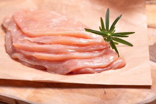 Raw sliced chicken meat close-up. Sotilissimo. Delicious dietary meat. Cooking,food of meat and fillets.Close-up view of raw, fresh, choped and sliced chicken meat.