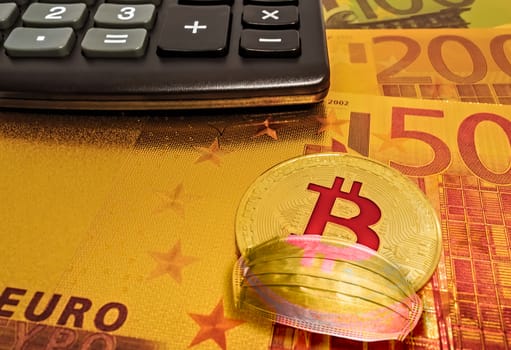 Calculator on EURO banknotes money Golden Bitcoin. Physical bit coin digital currency with a face Mask Particulate Respirator COVID-19 SARS Coronavirus Concept quarantine economy.