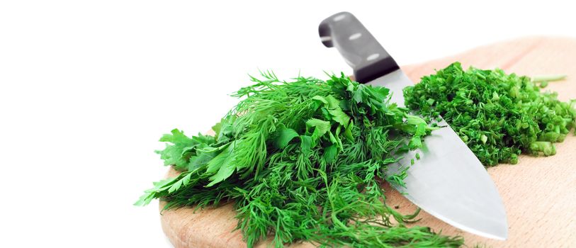 organic dill herb cutting chef knife isolated on white background. Top view cooking and home concept.