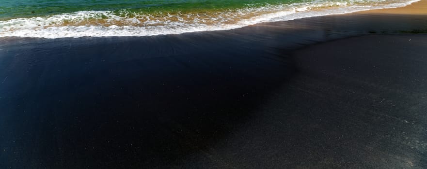World Water Day Sea wave Vulcan black sand coast in the town of Mirissa, Sri Lanka