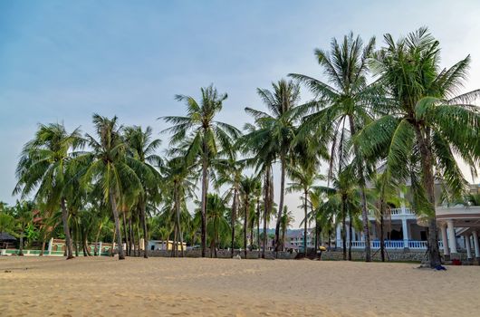 Summer Vacation and Holiday Trip Luxury resort hotel. Beach chair on sand beach blue sky in the background. Concept of travel and relax in paradise. Phu Quoc island in Vietnam.
