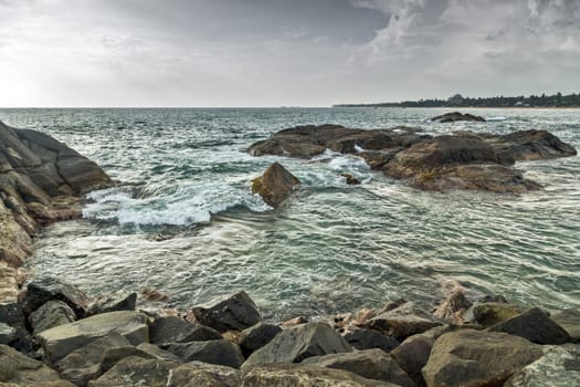 Waves crashing splashes rocks sea beach