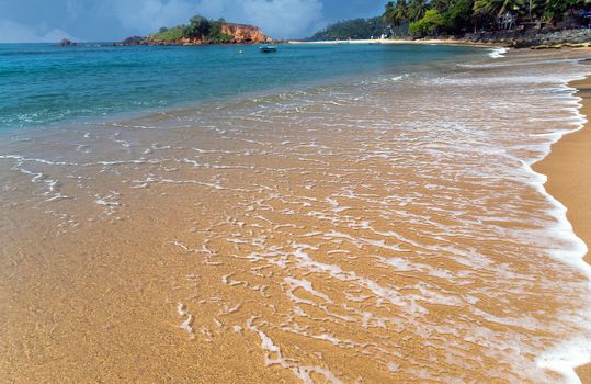 Beautiful bay with white sand beach, blue water, Parrot Rock Mirissa Sri Lanka