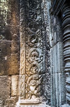 art of ancient Hindu god stone background, detail of the architecture in Bantey Srei temple in the Angkor area, Cambodia.