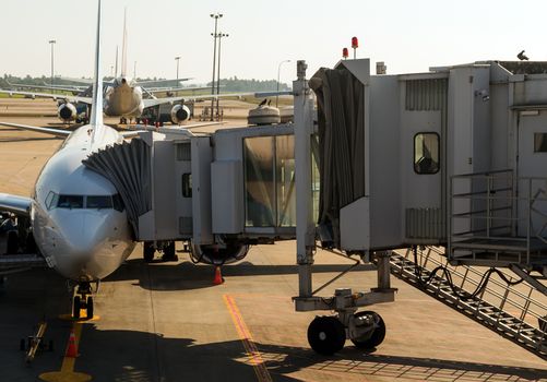 Airplane view Airport gate Terminal Departure & Arrival jetway, Plane terminal building parking area.