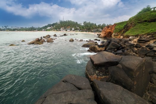 rocks on a sandy tropical beach in Mirissa, Parrot Rock, Sri Lanka.