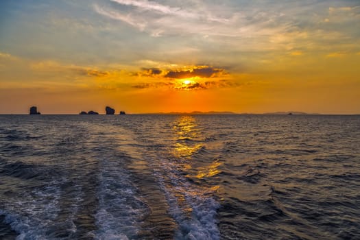 Sea Sunset evening island. Beauty Scene or sun over colorful sky with clouds Seascape. Tourism travel, vacation concept tropical nature background