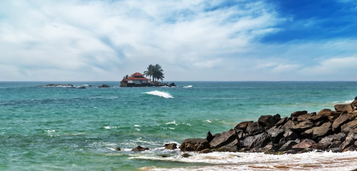 resort on tropical island with palm tree in Indian Ocean