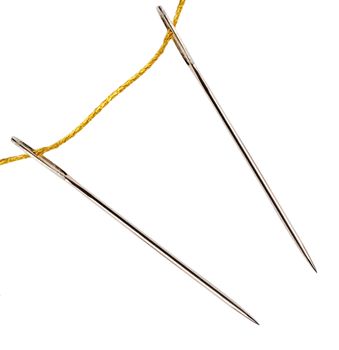 needle golden vintage thread isolated on white background