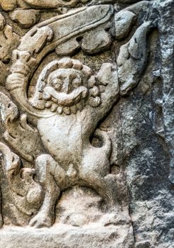 art of ancient Hindu god stone background, detail of the architecture in Bantey Srei temple in the Angkor area, Cambodia.