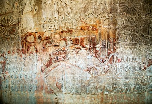 Khmer relief carving of gods fighting demons. Inner wall of the temple of Angkor Wat, Siem Reap, Cambodia.