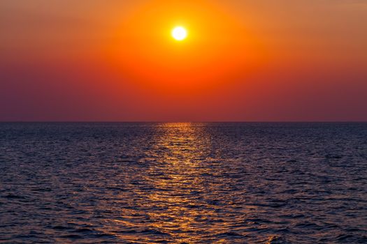 Sea Sunset Beach, paradise evening Orange light. Beauty Scene or sun over colorful sky with clouds Seascape.