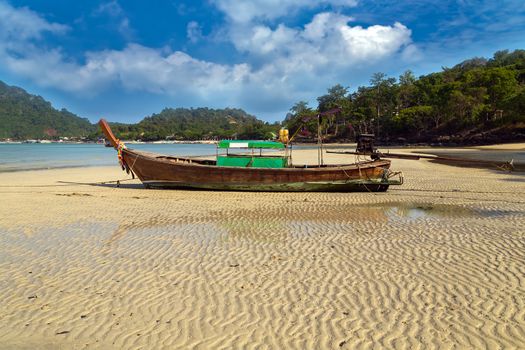 Traditional thai old boats on sand beach island Thailand