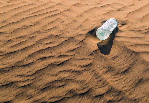 mineral water bottles in sand dunes eco concept nature landscape desert