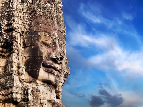 Buddhist Stone face in Bayon Temple Angkor Thom, Cambodia. Ancient monument Khmer architecture.